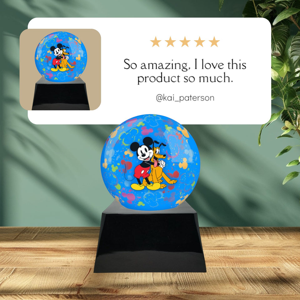 Memorials4u blue sphere urn with Mickey Mouse and Pluto, colorful paint splatters, on a black base.